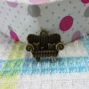 Bronze couch charm